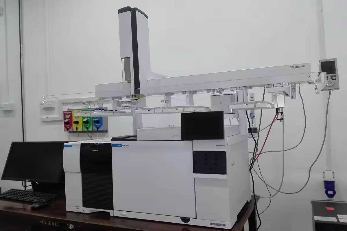 Scientist analyzing organic agricultural samples using advanced chromatography equipment